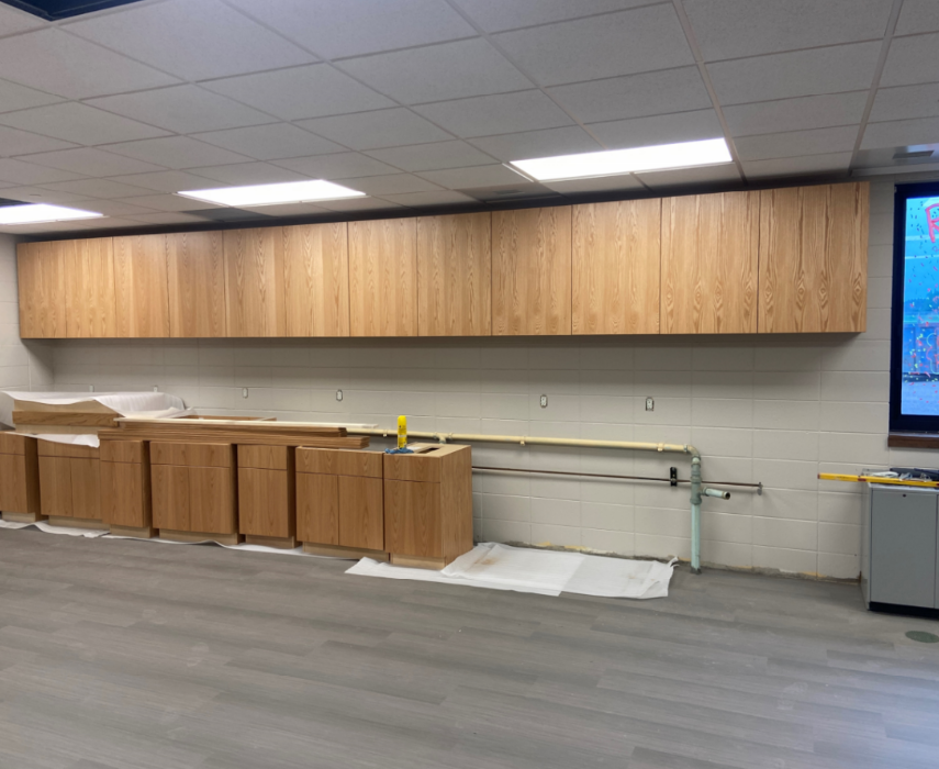The new flooring and upper cabinets in the middle school science room have been installed.
