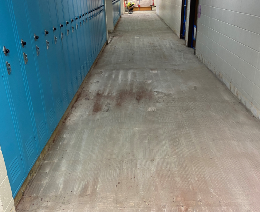 The floor tile in the middle school hallways have been removed in preparation for flooring leveling.