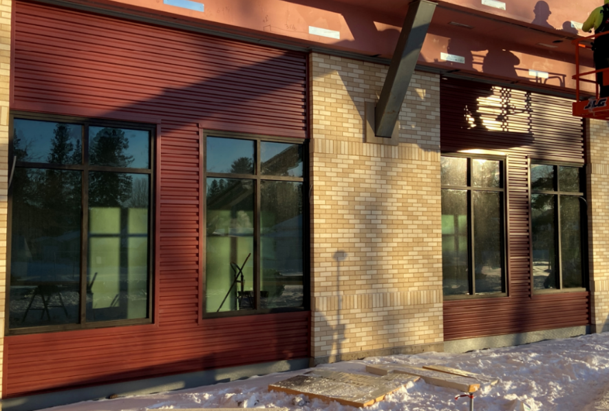 Metal panel installation has continued with the corrugated panel wrapping up