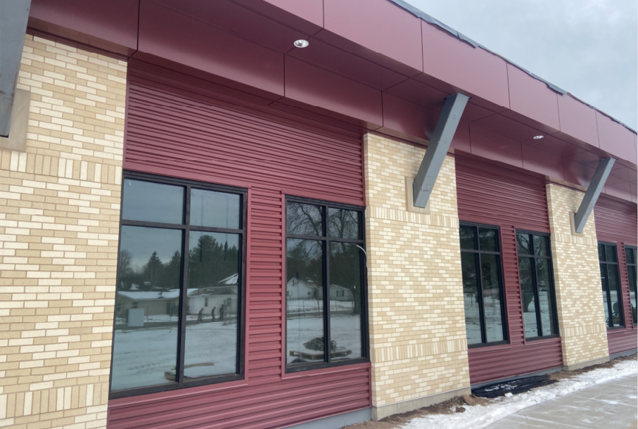 Metal panel on the south side of the building is receiving its finishing touches