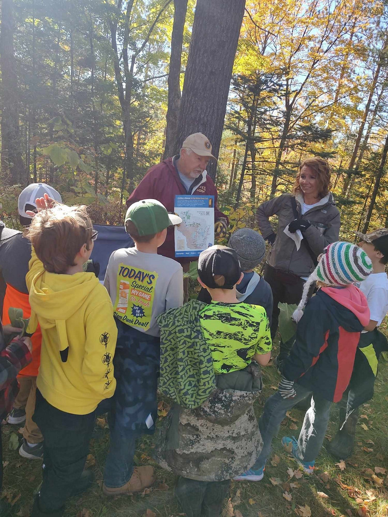 Mrs. Weik's class learning to read a map in the forest