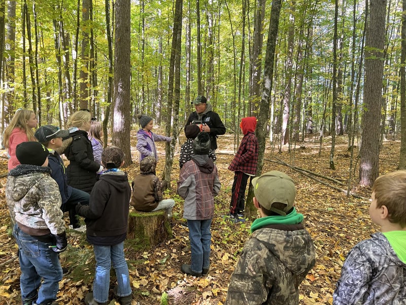 Students learning about exploring the woods