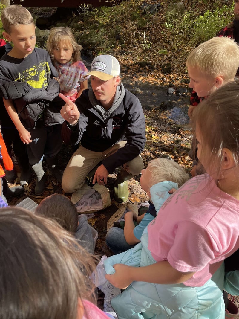 Students learning about mosquito larva