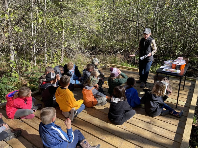 Students learning about amphibians