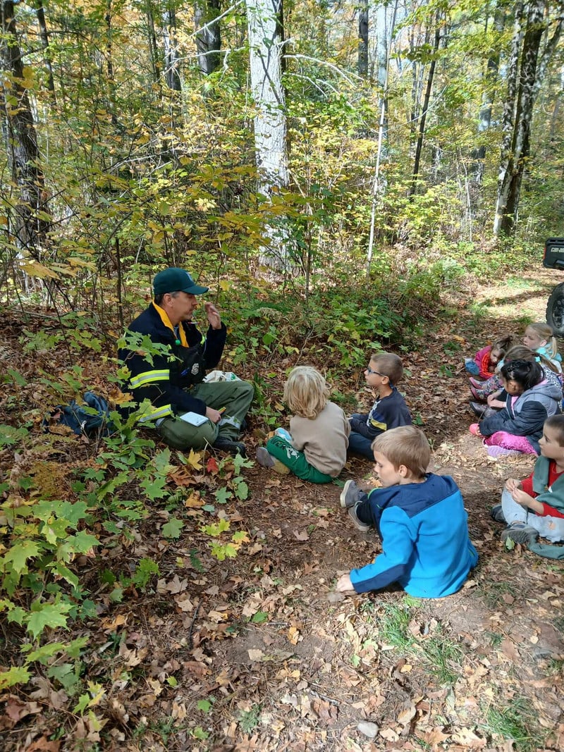 Local firefighter explaining forest safety