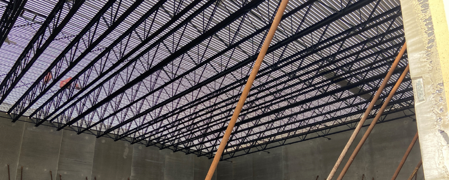 The long span joists and roof decking have been installed above the new gym.