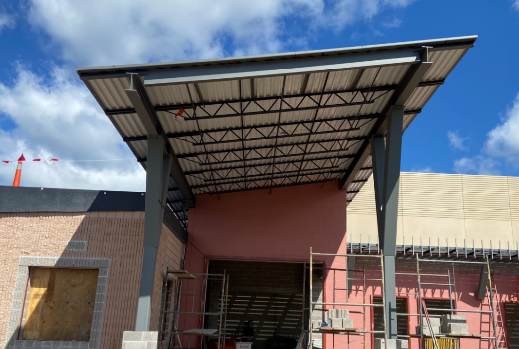 The canopy over the new main entrance has been installed and awaits the completed brick around the columns.