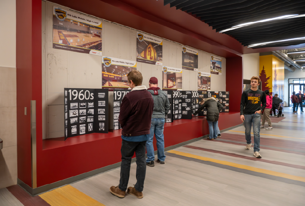 The new trophy case made for a fantastic place to put historical Rib Lake photos. In the coming weeks, the background of this case will be updated with a section of the old high school gym floor